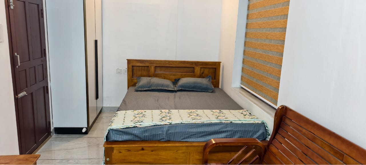 Family room with modern amenities at Pranavam Homestay Guruvayur